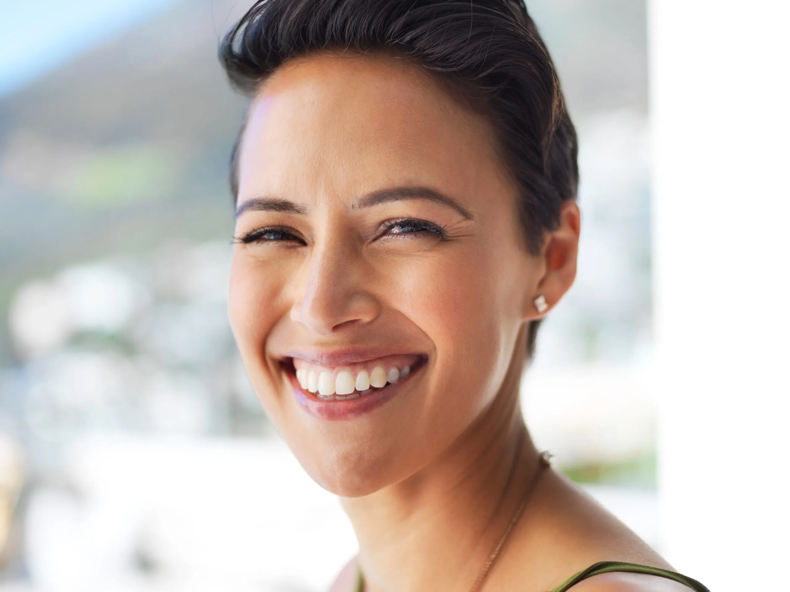closeup of a woman with a perfect smile, new dental implants